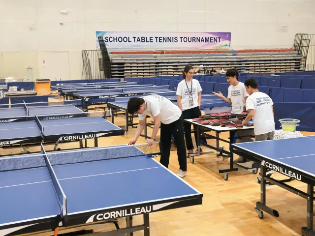 Table tennis table being prepared for event